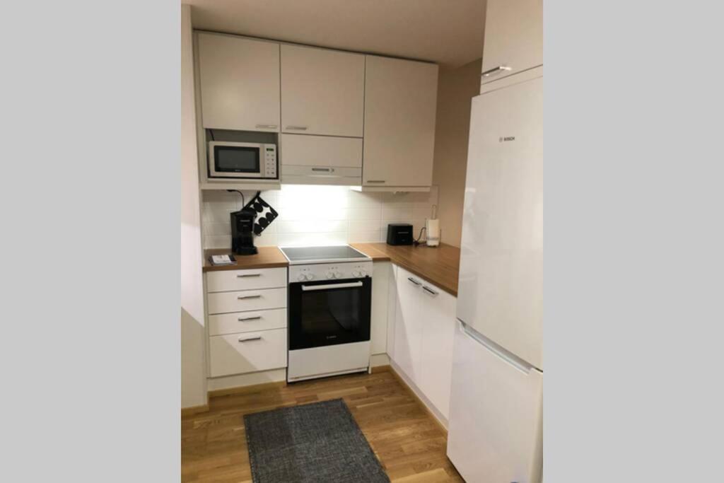 Апартаменты Keskustan Kaksio 45 M2 Autopaikalla, Rautatienkatu 19, 9 Krs Оулу Экстерьер фото